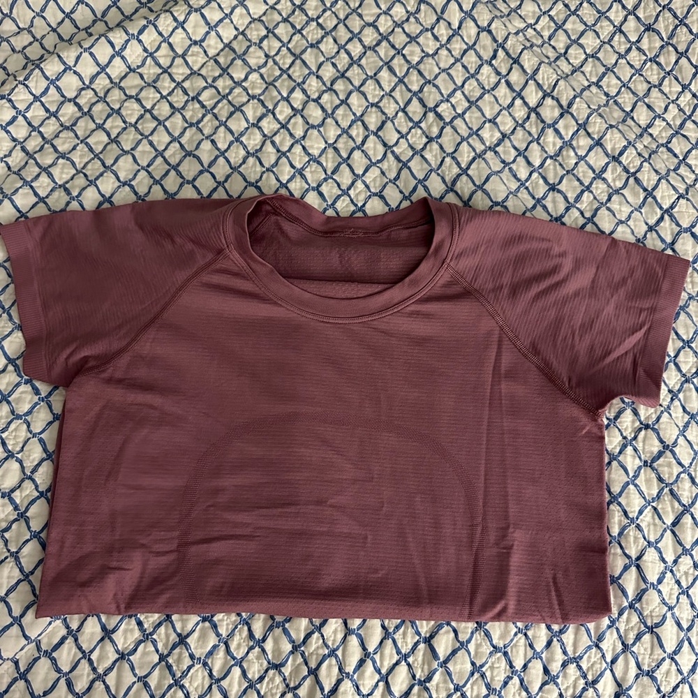 Purple Lulu swiftly shirt size 8. Color is way brighter in person.